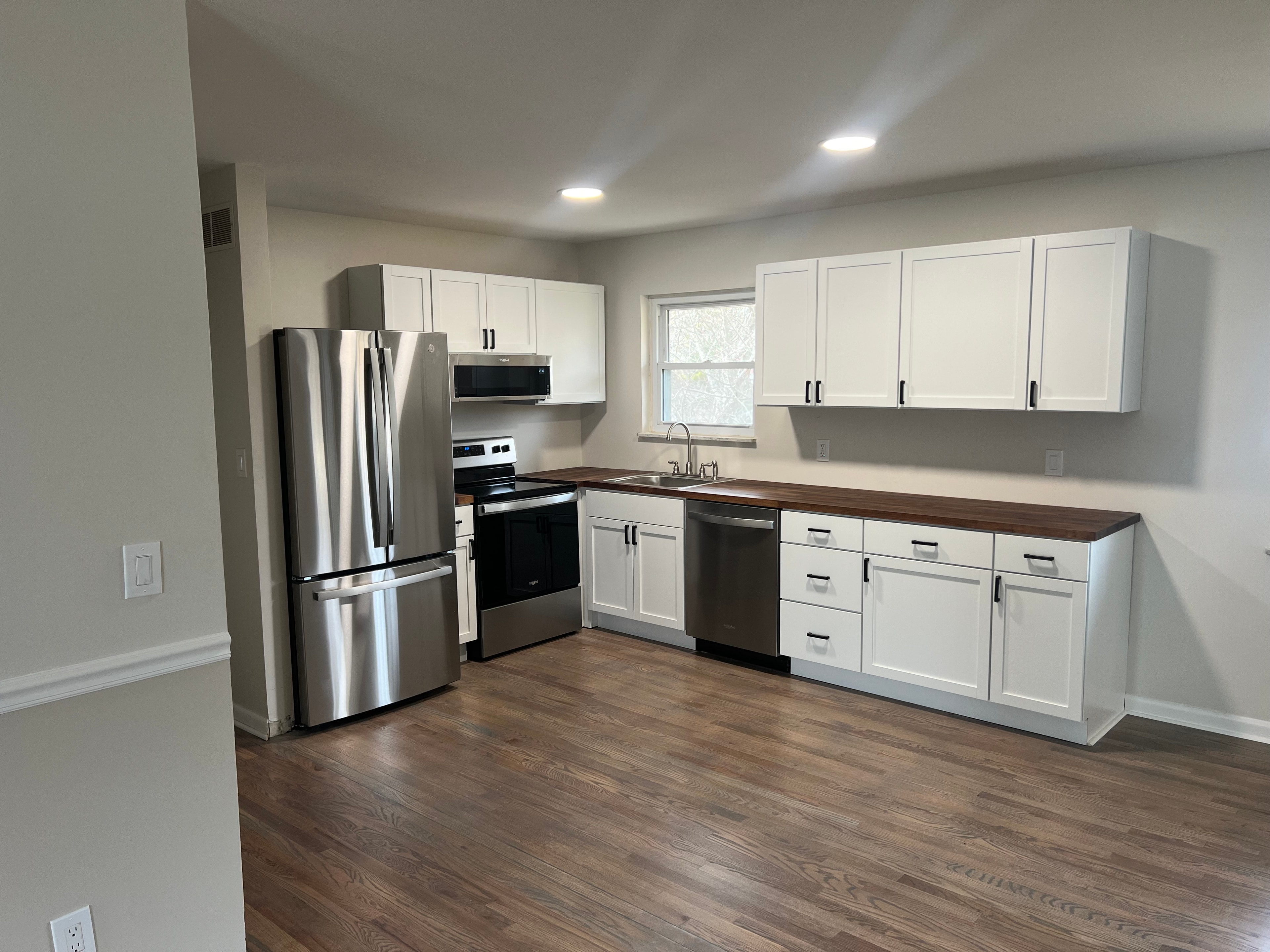 Bright renovated Oakley kitchen with blue cabinetry and island